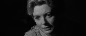 Movie still from “The Innocents” (1961), directed by Jack Clayton – A black and white photo of a woman's face; Close Up shot, Over the shoulder angle