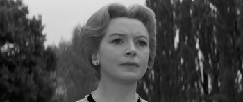 Movie still from “The Innocents” (1961), directed by Jack Clayton – An old black and white photo of a woman looking at the camera; Close Up shot, Low angle