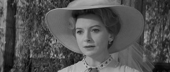 Movie still from “The Innocents” (1961), directed by Jack Clayton – Black and white photograph of a woman wearing a hat; Close Up shot, Over the shoulder angle