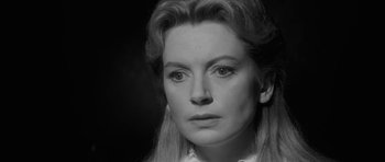 Movie still from “The Innocents” (1961), directed by Jack Clayton – Black and white photograph of a woman with long blonde hair; Close Up shot, Over the shoulder angle