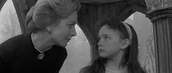 Movie still from “The Innocents” (1961), directed by Jack Clayton – A woman and a young girl looking at each other; Close Up shot, Over the shoulder angle