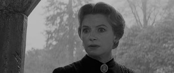 Movie still from “The Innocents” (1961), directed by Jack Clayton – An old photo of a woman looking at the camera; Close Up shot, Low angle