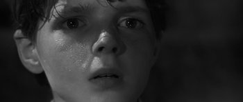 Movie still from “The Innocents” (1961), directed by Jack Clayton – A child's face with tears coming out of his eyes; Close Up shot, Low angle