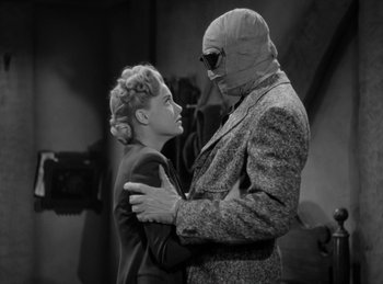 Movie still from “The Invisible Man Returns” (1940), directed by Joe May – A man and a woman dressed up as the invisible man; Medium shot, Low angle