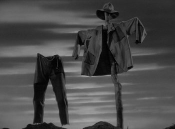 Movie still from “The Invisible Man Returns” (1940), directed by Joe May – An image of a scarecrow with a hat and pants; Wide shot, Low angle