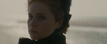 Movie still from “The Invisible Woman” (2013), directed by Ralph Fiennes – A person wearing a hat; Close Up shot, Over the shoulder angle