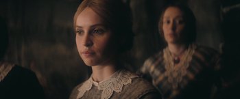 Movie still from “The Invisible Woman” (2013), directed by Ralph Fiennes – A woman in a grey sweater and a woman in a white shirt; Close Up shot, Over the shoulder angle