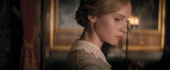 Movie still from “The Invisible Woman” (2013), directed by Ralph Fiennes – A young girl wearing a dress with a lace collar; Close Up shot, Low angle