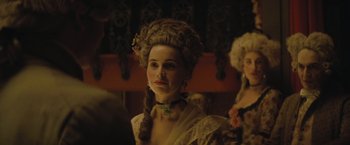 Movie still from “The Invisible Woman” (2013), directed by Ralph Fiennes – A person wearing a wig; Close Up shot, Over the shoulder angle