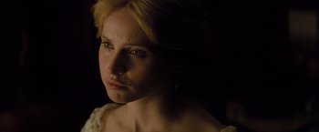 Movie still from “The Invisible Woman” (2013), directed by Ralph Fiennes – A person wearing a white dress; Close Up shot, Over the shoulder angle