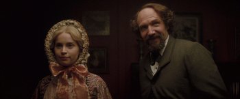 Movie still from “The Invisible Woman” (2013), directed by Ralph Fiennes – A man and a woman standing next to each other in a room; Medium shot, Over the shoulder angle