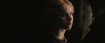 Movie still from “The Invisible Woman” (2013), directed by Ralph Fiennes – A woman with blonde hair is looking into the distance; Close Up shot, Low angle