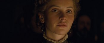 Movie still from “The Invisible Woman” (2013), directed by Ralph Fiennes – A person wearing a dress; Close Up shot, Low angle