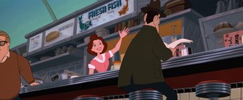 Movie still from “The Iron Giant” (1999), directed by Brad Bird – An animated picture of a woman and a man at a fish market; Medium shot, Over the shoulder angle