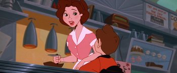 Movie still from “The Iron Giant” (1999), directed by Brad Bird – A woman in a pink dress is talking to a man in a red shirt; Medium shot, Over the shoulder angle