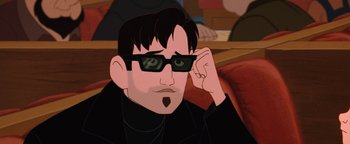 Movie still from “The Iron Giant” (1999), directed by Brad Bird – A man with glasses sitting in front of his face; Close Up shot, Low angle