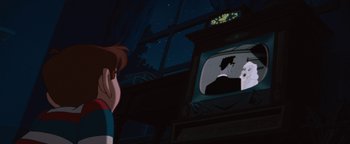 Movie still from “The Iron Giant” (1999), directed by Brad Bird – A person looking at a television in a dark room; Close Up shot, Over the shoulder angle