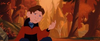 Movie still from “The Iron Giant” (1999), directed by Brad Bird – A young boy sitting in front of a forest; Close Up shot, High angle