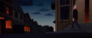 Movie still from “The Iron Giant” (1999), directed by Brad Bird – A person sitting on a ledge in front of some buildings; Extreme Wide shot, Low angle
