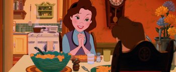 Movie still from “The Iron Giant” (1999), directed by Brad Bird – A woman sitting at a dinner table in front of other people; Medium shot, High angle