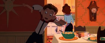 Movie still from “The Iron Giant” (1999), directed by Brad Bird – A cartoon of a boy and a woman in a kitchen; Medium shot, Low angle