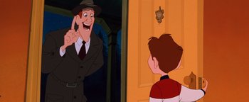 Movie still from “The Iron Giant” (1999), directed by Brad Bird – A man wearing a hat and a suit is talking to a boy; Medium shot, Over the shoulder angle