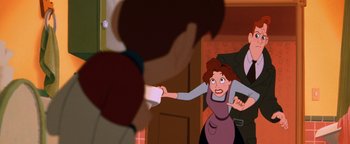 Movie still from “The Iron Giant” (1999), directed by Brad Bird – A woman holding a remote control in front of another woman; Medium shot, Over the shoulder angle