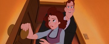 Movie still from “The Iron Giant” (1999), directed by Brad Bird – A man and a woman are sitting on the floor; Close Up shot, Over the shoulder angle