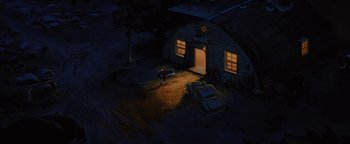 Movie still from “The Iron Giant” (1999), directed by Brad Bird – An animated picture of a man standing in front of a building; Extreme Wide shot, High angle