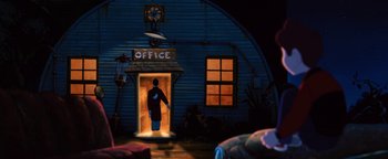 Movie still from “The Iron Giant” (1999), directed by Brad Bird – A man standing in front of an office at night; Wide shot, Low angle