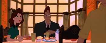 Movie still from “The Iron Giant” (1999), directed by Brad Bird – An animated man sitting at a table with a plate of food in front of him; Medium shot, Over the shoulder angle