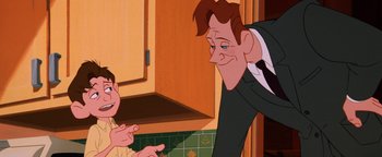 Movie still from “The Iron Giant” (1999), directed by Brad Bird – A man in a suit and tie talking to a boy in a suit and tie; Medium shot, Over the shoulder angle