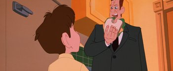 Movie still from “The Iron Giant” (1999), directed by Brad Bird – A man in a suit and tie holding a piece of food in his hand; Close Up shot, Over the shoulder angle