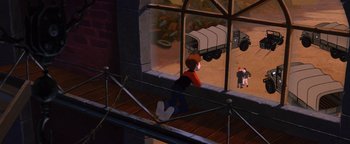 Movie still from “The Iron Giant” (1999), directed by Brad Bird – A boy is looking out of a window at a truck; Wide shot, High angle