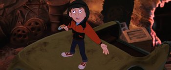 Movie still from “The Iron Giant” (1999), directed by Brad Bird – An animated boy is holding a remote control; Medium shot, High angle