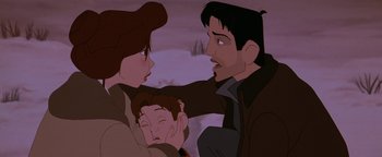 Movie still from “The Iron Giant” (1999), directed by Brad Bird – A man and a woman holding another man's face; Close Up shot, Over the shoulder angle