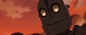 Movie still from “The Iron Giant” (1999), directed by Brad Bird – View of the eyes of a cartoon robot; Close Up shot, Low angle