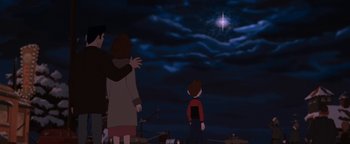 Movie still from “The Iron Giant” (1999), directed by Brad Bird – Two people and a child looking up at a star; Wide shot, Low angle
