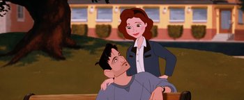 Movie still from “The Iron Giant” (1999), directed by Brad Bird – A man and a woman standing next to each other in front of a building; Medium shot, Low angle