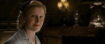 Movie still from “The Iron Lady” (2011), directed by Phyllida Lloyd – A person wearing a necklace; Close Up shot, Over the shoulder angle