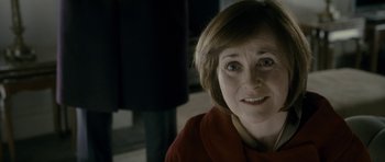 Movie still from “The Iron Lady” (2011), directed by Phyllida Lloyd – A person with short hair; Close Up shot, Over the shoulder angle