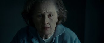 Movie still from “The Iron Lady” (2011), directed by Phyllida Lloyd – An older woman with a sad look on her face; Close Up shot, Low angle