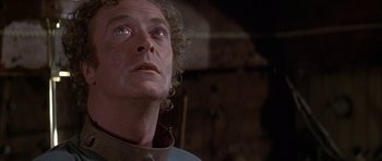 Movie still from “The Island” (1980), directed by Michael Ritchie – A person looking up at the sky; Close Up shot, Low angle