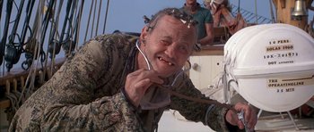 Movie still from “The Island” (1980), directed by Michael Ritchie – An old man with a bunch of wires on his head; Close Up shot, Low angle