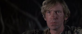 Movie still from “The Island” (1980), directed by Michael Ritchie – A man's face in the dark; Close Up shot, Low angle