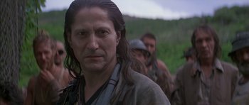 Movie still from “The Island” (1980), directed by Michael Ritchie – A person with long hair; Close Up shot, Over the shoulder angle