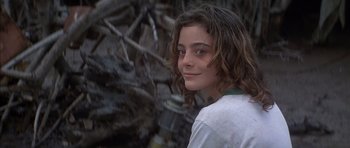 Movie still from “The Island” (1980), directed by Michael Ritchie – A young girl is smiling for the camera; Close Up shot, Low angle