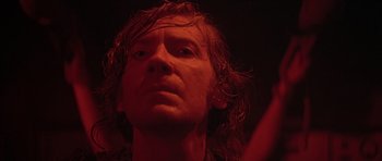 Movie still from “The Island” (1980), directed by Michael Ritchie – A person with long hair; Close Up shot, Low angle