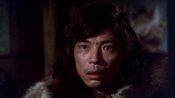 Movie still from “The Island at the Top of the World” (1974), directed by Robert Stevenson – A man wearing a fur coat and a fur hat; Close Up shot, Low angle