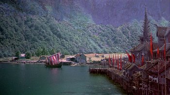 Movie still from “The Island at the Top of the World” (1974), directed by Robert Stevenson – A boat in the middle of the water; Extreme Wide shot, High angle